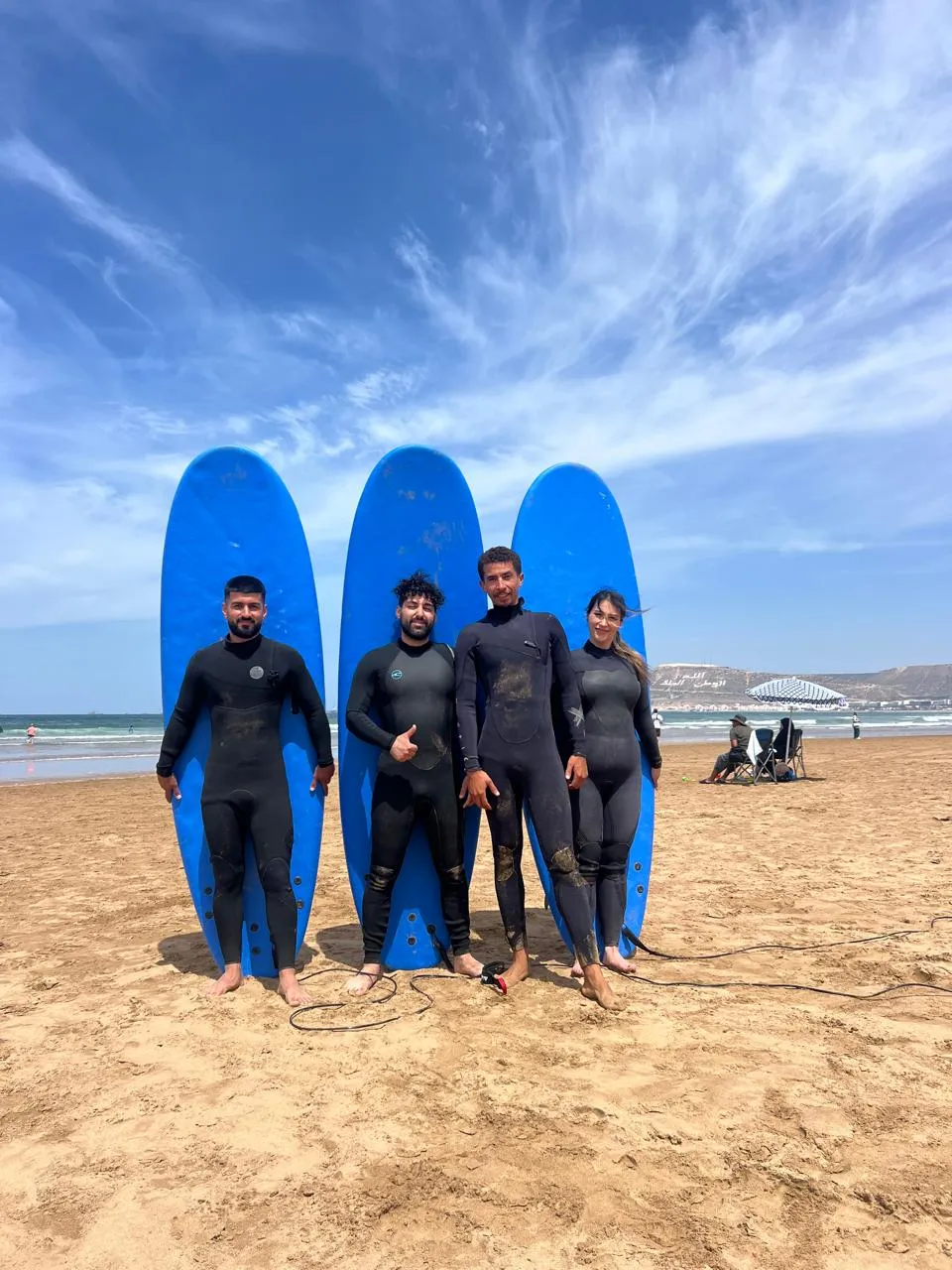 Simo running a morning surf class on the beach at Anza